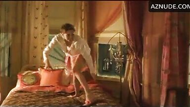 Charlize Theron having fun at the head of the bed