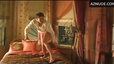 Charlize Theron having fun at the head of the bed