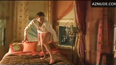 Charlize Theron having fun at the head of the bed