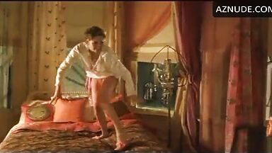 Charlize Theron having fun at the head of the bed