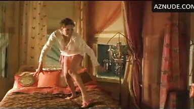 Charlize Theron having fun at the head of the bed
