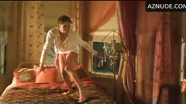 Charlize Theron having fun at the head of the bed