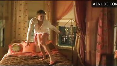 Charlize Theron having fun at the head of the bed