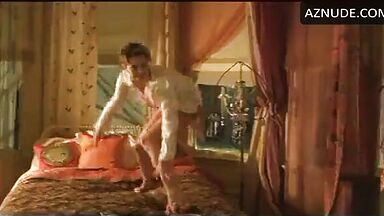 Charlize Theron having fun at the head of the bed