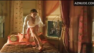 Charlize Theron having fun at the head of the bed