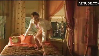 Charlize Theron having fun at the head of the bed