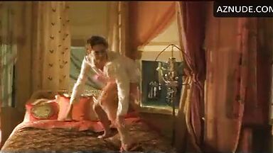 Charlize Theron having fun at the head of the bed