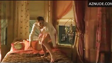 Charlize Theron having fun at the head of the bed