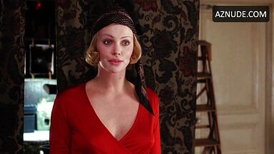 Charlize Theron is sexy in her red shirt