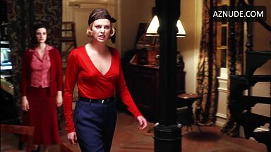 Charlize Theron is sexy in her red shirt