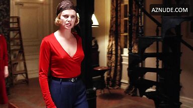 Charlize Theron is sexy in her red shirt