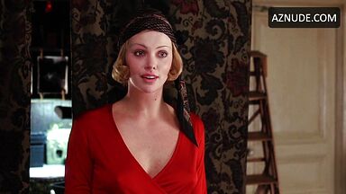 Charlize Theron is sexy in her red shirt