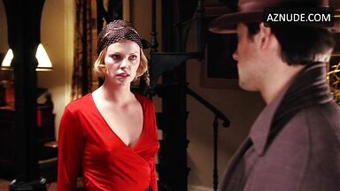 Charlize Theron is sexy in her red shirt