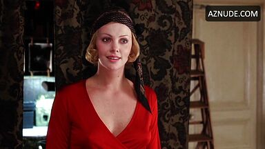 Charlize Theron is sexy in her red shirt