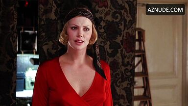 Charlize Theron is sexy in her red shirt