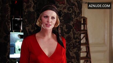 Charlize Theron is sexy in her red shirt