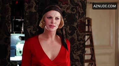 Charlize Theron is sexy in her red shirt