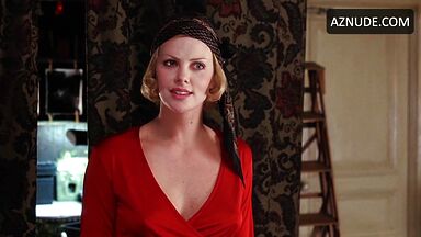 Charlize Theron is sexy in her red shirt