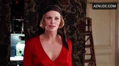 Charlize Theron is sexy in her red shirt