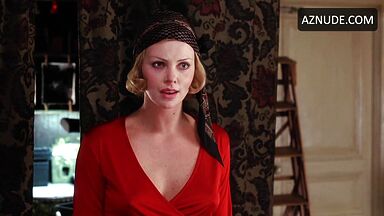Charlize Theron is sexy in her red shirt