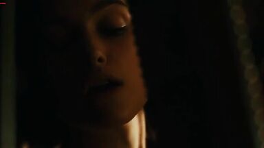 Keira Knightley emerges from a well wet