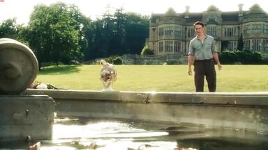 Keira Knightley emerges from a well wet