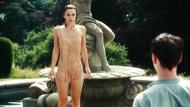 Keira Knightley emerges from a well wet