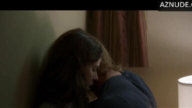 Kissing her agaist the wall