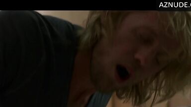 Kissing her agaist the wall