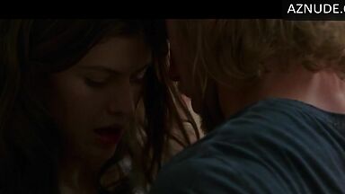 Kissing her agaist the wall