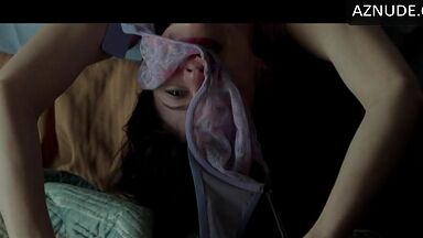 Kissing her agaist the wall