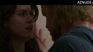 Kissing her agaist the wall