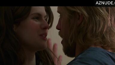 Kissing her agaist the wall