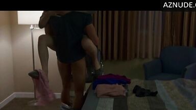 Kissing her agaist the wall